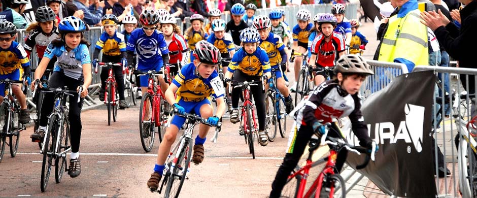 Young riders lined up on the start line at a Johnstone Jets race